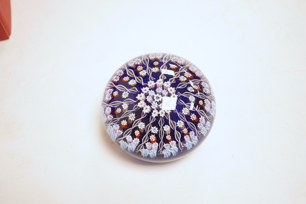 Three boxed Perthshire paperweights together with two further examples, unboxed, some millefiori, largest 7cm in diameter (5)